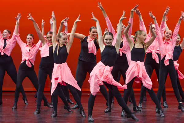 Young students dancing at the Holy Cross College Dance Showcase